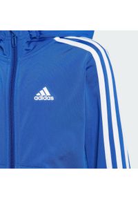 Adidas - Essentials 3-Stripes Shiny Track Suit. Okazja: na uczelnię, na co dzień. Kolor: niebieski, wielokolorowy, biały. Materiał: dresówka, materiał. Styl: sportowy, casual