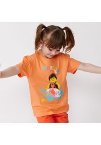 Koszulka dziecięca LEGO Tano 317, 100% bawełna organiczna, pomarańczowa.. Kolor: żółty, wielokolorowy, pomarańczowy. Materiał: bawełna. Wzór: nadruk #1