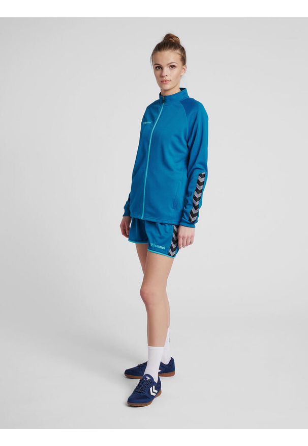 Kurtka damska Hummel Zip hmlAUTHENTIC Poly. Kolor: turkusowy, niebieski, wielokolorowy. Materiał: poliester. Sport: fitness