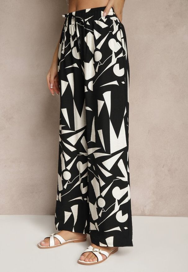 Renee - Czarne Szerokie Spodnie High Waist z Wiskozy Zdobione Abstrakcyjnym Printem Zileira. Okazja: na co dzień. Stan: podwyższony. Kolor: czarny. Materiał: wiskoza. Wzór: aplikacja, nadruk. Styl: klasyczny, elegancki, casual