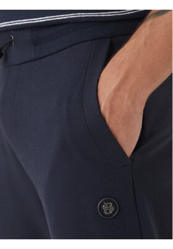 BOSS Spodnie dresowe 50555853 Granatowy Regular Fit. Kolor: niebieski. Materiał: bawełna