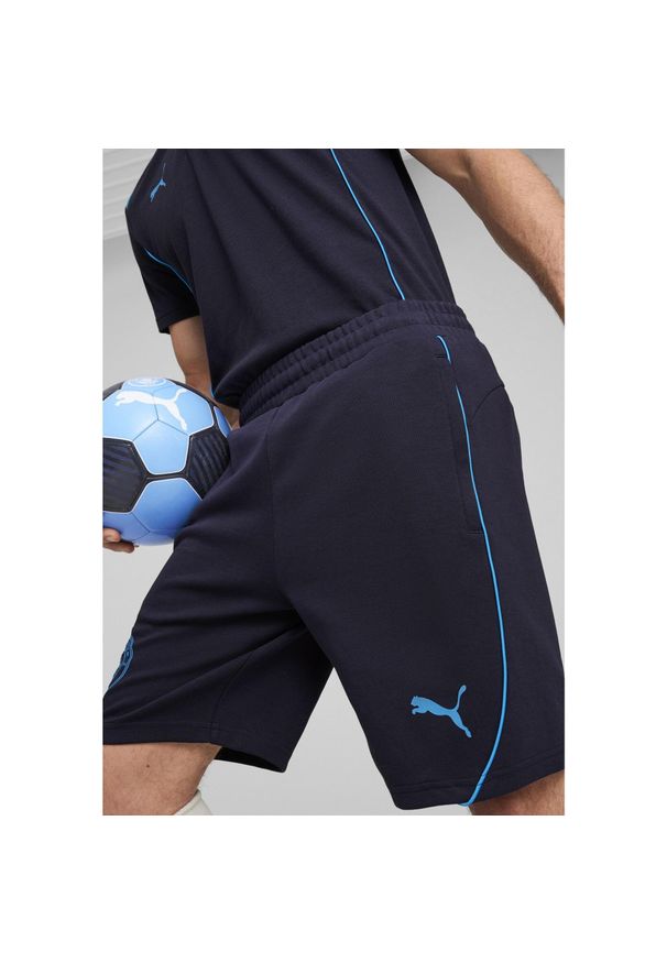 Puma - Męskie szorty Casuals Manchester City PUMA New Navy Magic Blue. Kolor: niebieski. Sport: piłka nożna