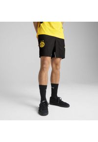 Puma - Męskie szorty Borussia Dortmund ftblARCHIVE PUMA Black Faster Yellow. Kolor: czarny, wielokolorowy, żółty. Wzór: aplikacja. Sport: piłka nożna