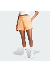 Adidas - Szorty Soft Lux Loose. Kolor: pomarańczowy. Sport: fitness #1