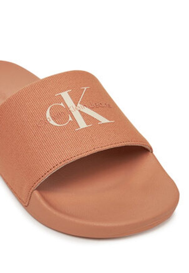 Calvin Klein Jeans Klapki Slide Monogram Wn YW0YW01835 Koralowy. Kolor: pomarańczowy. Materiał: materiał