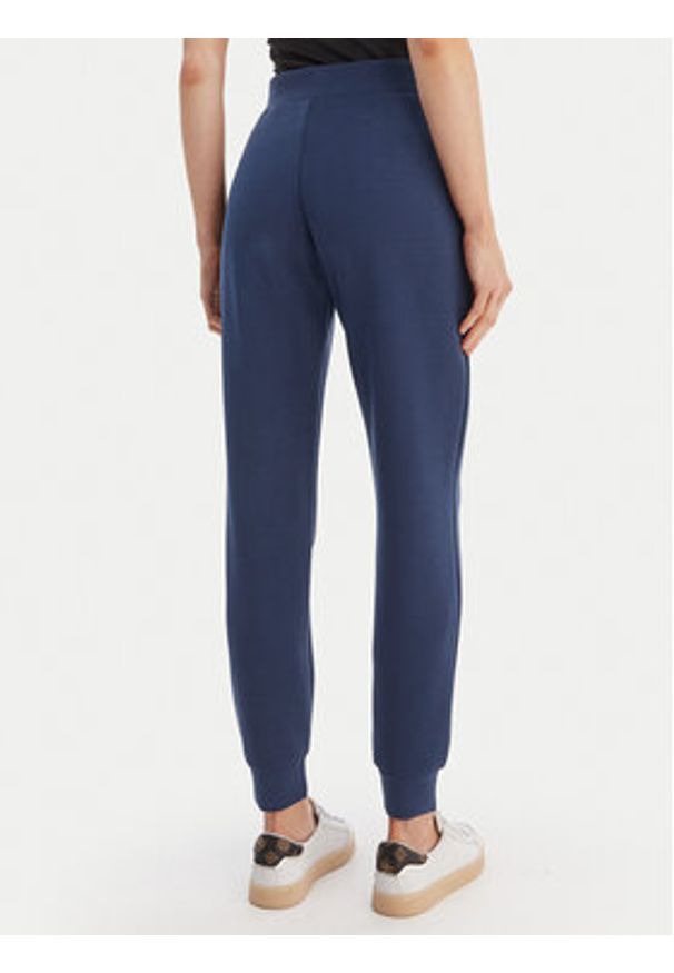 Guess Spodnie dresowe V4YB08 KCAY2 Granatowy Regular Fit. Kolor: niebieski. Materiał: syntetyk