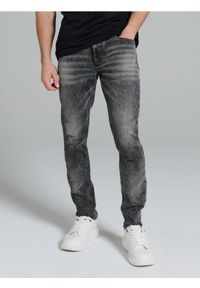 Sinsay - Jeansy slim fit z efektem sprania - szary. Kolor: szary