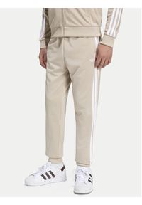 Adidas - adidas Spodnie dresowe Sst Track IA2239 Beżowy jasny Regular Fit. Kolor: beżowy. Materiał: syntetyk #3