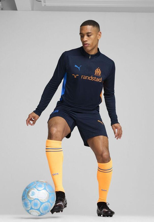 Puma - Męska bluza treningowa Olympique Marsylia z zamkiem 1/4 PUMA. Kolor: pomarańczowy, wielokolorowy, niebieski, żółty. Sport: fitness