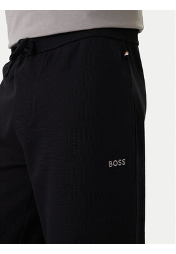 BOSS Spodnie dresowe Waffle 50535878 Czarny Regular Fit. Kolor: czarny. Materiał: syntetyk, bawełna