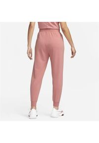Spodnie sportowe męskie Nike FB5434618. Kolor: różowy, wielokolorowy. Materiał: dresówka. Sport: turystyka piesza