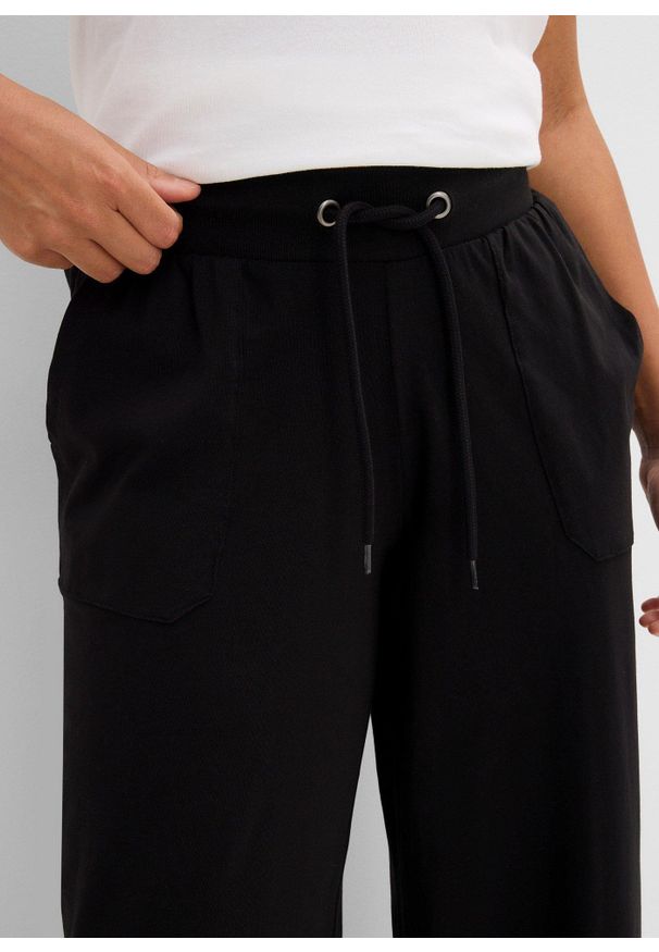 bonprix - Spodnie sportowe z mieszanki bawełny. Kolor: czarny. Materiał: bawełna. Styl: sportowy