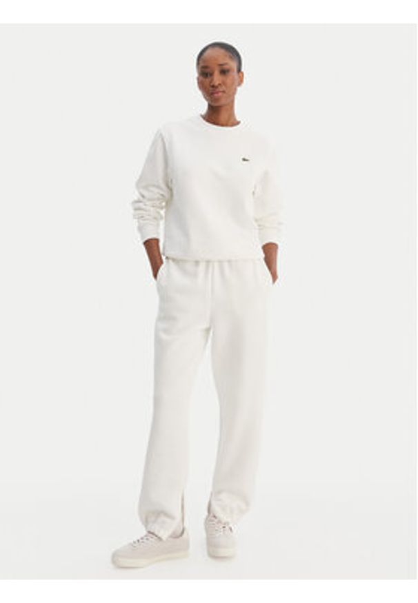 Lacoste Spodnie dresowe XF5244 Écru Regular Fit. Kolor: kremowy. Materiał: bawełna