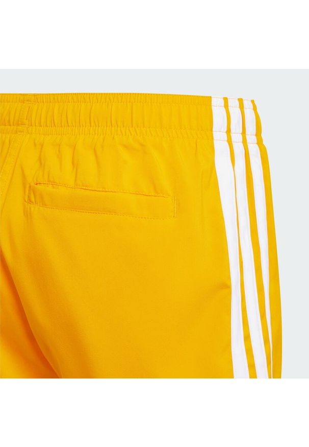 Adidas - Szorty 3-Stripes Swim Kids. Kolor: pomarańczowy, biały, wielokolorowy. Materiał: materiał