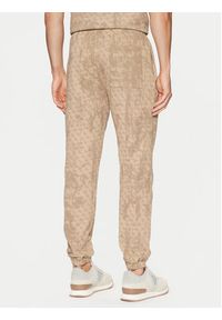 Guess Spodnie dresowe Z5RB14 K9YI1 Beżowy Regular Fit. Kolor: beżowy. Materiał: bawełna