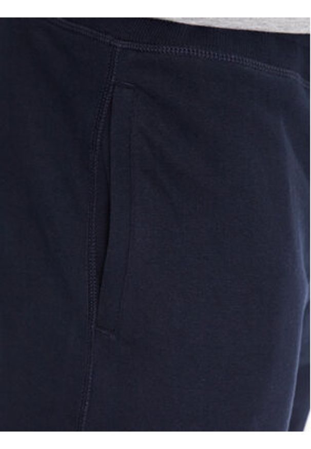 TOMMY HILFIGER - Tommy Hilfiger Spodnie dresowe UM0UM02880 Granatowy Regular Fit. Kolor: niebieski. Materiał: syntetyk, bawełna