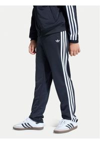 Adidas - adidas Spodnie dresowe Firebird Track KE0910 Czarny Regular Fit. Kolor: czarny. Materiał: syntetyk #1