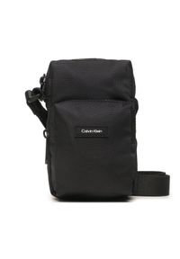 Calvin Klein Saszetka Ck Must T Reporter Xs K50K510570 Czarny. Kolor: czarny. Materiał: materiał