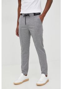 Calvin Klein Jeans spodnie dresowe męskie kolor szary gładkie. Kolor: szary. Materiał: dresówka. Wzór: gładki
