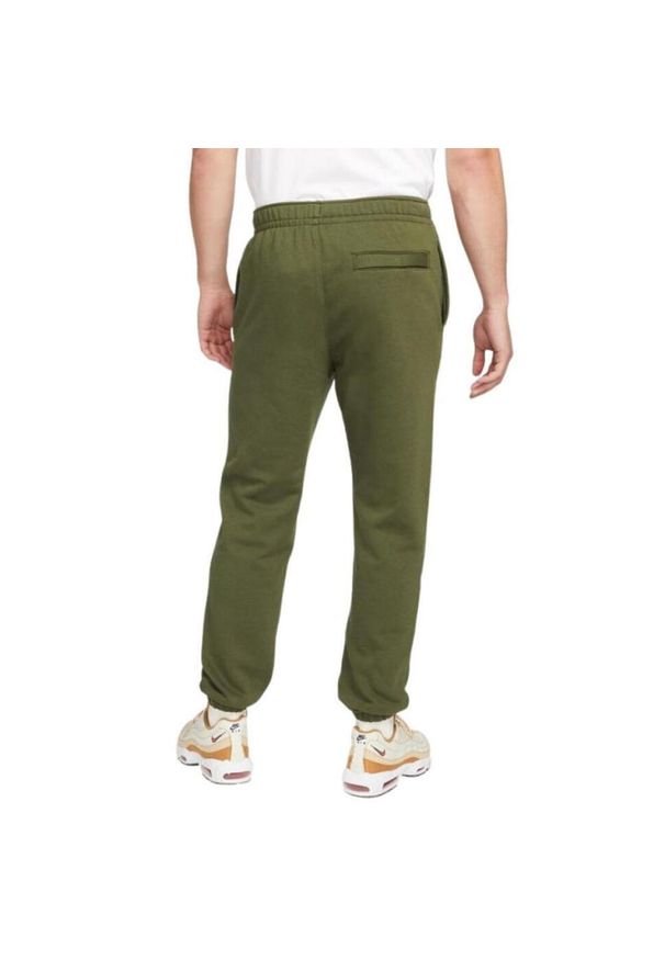 Nike - Spodnie Do Joggingu Męskie Polar NSW Club. Kolor: zielony. Materiał: polar. Sport: bieganie