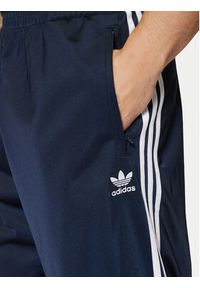 Adidas - adidas Spodnie dresowe adicolor Classics Firebird IM9471 Granatowy Regular Fit. Kolor: niebieski. Materiał: syntetyk #5