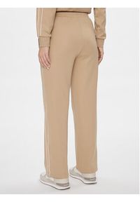 Puma Spodnie dresowe T7 624212 Beżowy Relaxed Fit. Kolor: beżowy. Materiał: syntetyk, bawełna #3