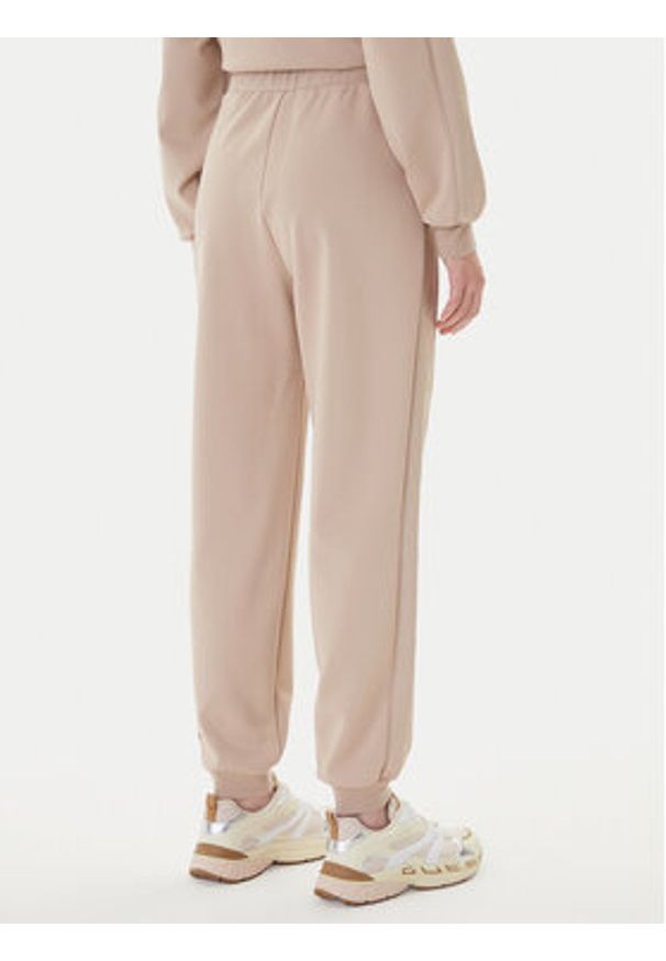 Guess Spodnie dresowe V5BB23 KCX22 Beżowy Regular Fit. Kolor: beżowy. Materiał: syntetyk