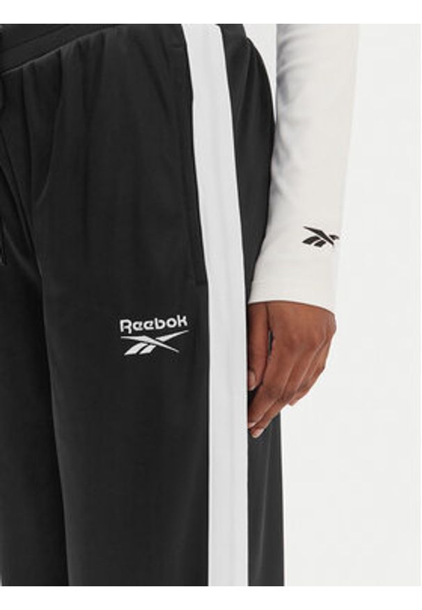 Reebok Spodnie dresowe Dianne RK25512CCW Czarny Relaxed Fit. Kolor: czarny. Materiał: syntetyk