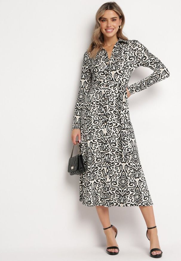 Born2be - Czarno-Biała Rozkloszowana Sukienka Midi o Koszulowym Fasonie z Ozdobnym Wzorem Liovia. Kolor: czarny. Materiał: materiał. Typ sukienki: koszulowe. Styl: klasyczny. Długość: midi