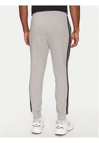Adidas - adidas Spodnie dresowe Essential 3-Stripes JE6346 Szary Regular Fit. Kolor: szary. Materiał: bawełna, syntetyk #5