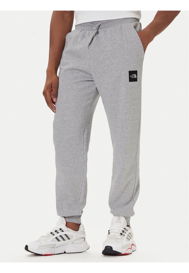 The North Face Spodnie dresowe Fine NF0A8C1K Szary Tapered Fit. Kolor: szary. Materiał: bawełna
