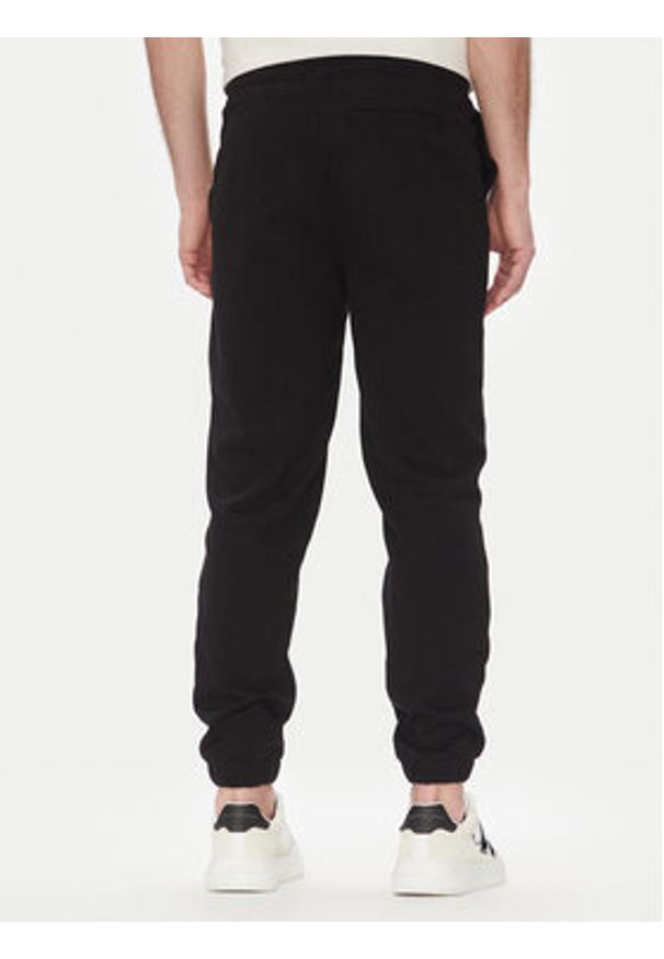 Calvin Klein Jeans Spodnie dresowe Painted J30J327535 Czarny Regular Fit. Kolor: czarny. Materiał: bawełna