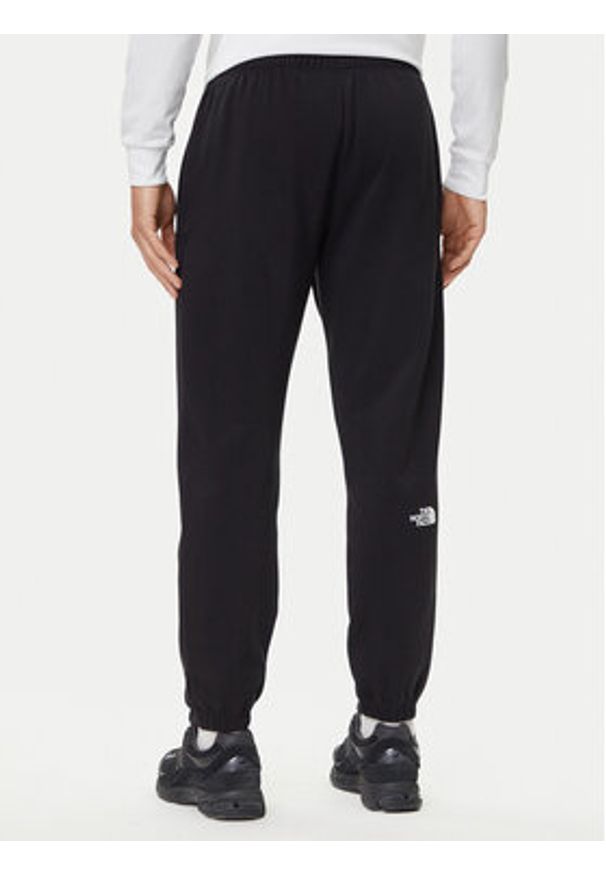 The North Face Spodnie dresowe Simple Dome NF0A8C1W Czarny Regular Fit. Kolor: czarny. Materiał: syntetyk, bawełna