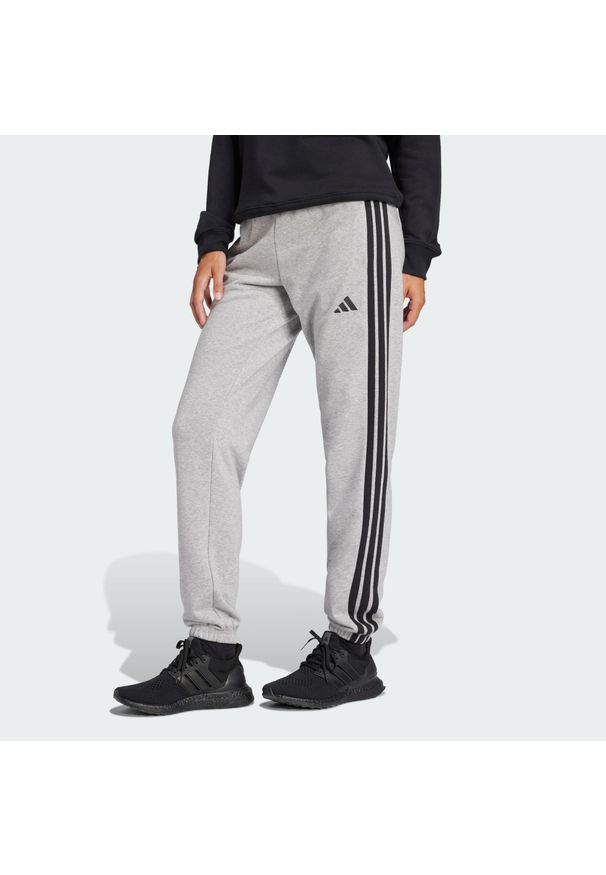 Adidas - Spodnie Essentials 3-Stripes French Terry Cuffed. Kolor: szary, wielokolorowy, czarny. Materiał: materiał. Sport: fitness