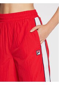 Fila Spodnie dresowe Zunyi FAW0263 Czerwony Regular Fit. Kolor: czerwony. Materiał: dresówka, syntetyk