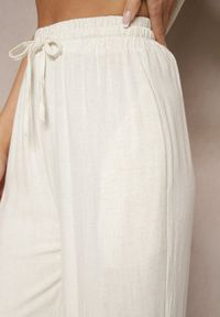 Renee - Jasnobeżowe Spodnie Palazzo o Szerokim Kroju High Waist Ozdobione Wiązaniem Sonariella. Okazja: na co dzień, na spotkanie biznesowe, do pracy. Stan: podwyższony. Kolor: beżowy. Wzór: aplikacja. Styl: klasyczny, elegancki, biznesowy, casual #3