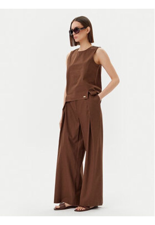 Barbour Spodnie materiałowe Barbour Lucy LTR0384BR53 Brązowy Regular Fit. Kolor: brązowy. Materiał: bawełna