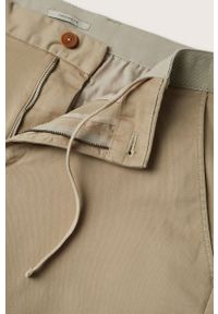 Mango Man Spodnie męskie kolor transparentny dopasowane. Kolor: beżowy. Materiał: włókno, tkanina. Wzór: gładki