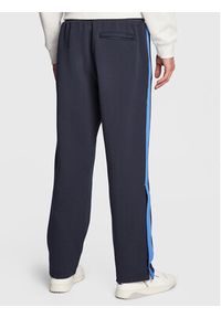 New Balance Spodnie dresowe MP23588 Granatowy Relaxed Fit. Kolor: niebieski. Materiał: dresówka, syntetyk