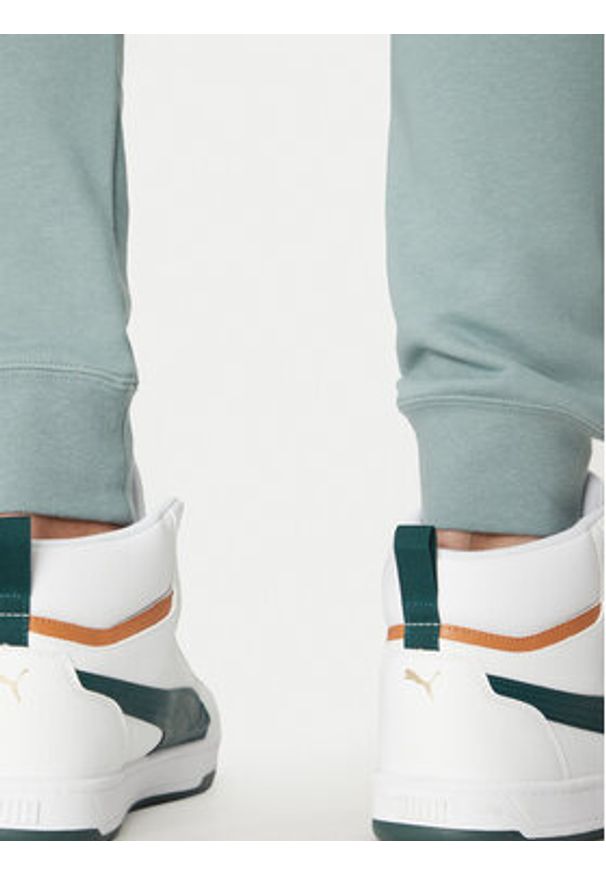Puma Spodnie dresowe Ess No. 1 Logo 682609 Zielony Regular Fit. Kolor: zielony. Materiał: syntetyk, bawełna