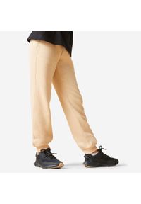 DOMYOS - Spodnie dresowe dla dzieci Domyos. Kolekcja: plus size. Kolor: beżowy. Materiał: dresówka #1