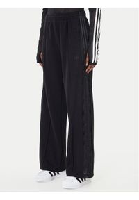 Adidas - adidas Spodnie dresowe Firebird Lace KD0351 Czarny Loose Fit. Kolor: czarny. Materiał: syntetyk, bawełna #1