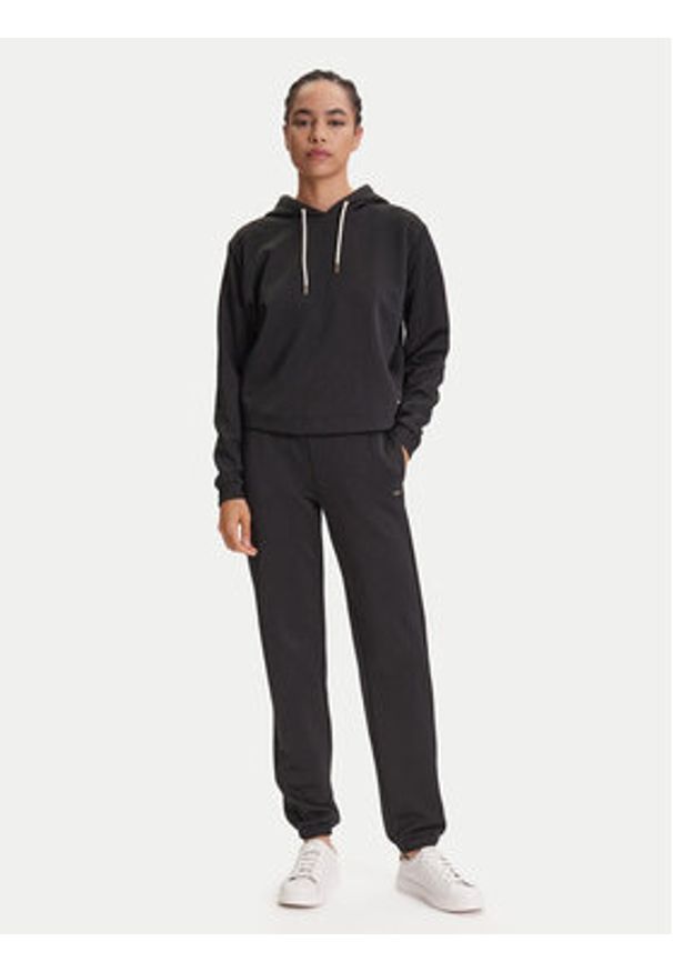 Guess Spodnie dresowe V5YB06 KBSL2 Czarny Regular Fit. Kolor: czarny. Materiał: syntetyk