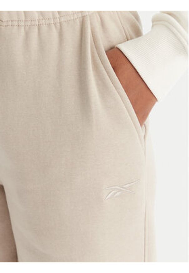Reebok Spodnie dresowe Reebok X Ewa Chodakowska Evren RK25308CCW Beżowy Regular Fit. Kolor: beżowy. Materiał: syntetyk