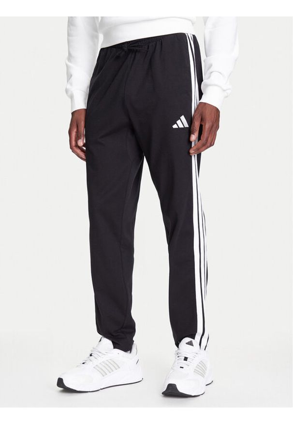 Adidas - adidas Spodnie dresowe Essentials 3-Stripes JE6430 Czarny Regular Fit. Kolor: czarny. Materiał: bawełna