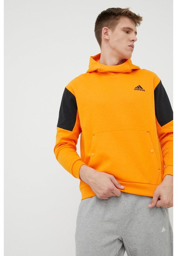 adidas Performance bluza HE9819 męska kolor pomarańczowy z kapturem z nadrukiem. Typ kołnierza: kaptur. Kolor: pomarańczowy. Materiał: poliester, bawełna. Wzór: nadruk