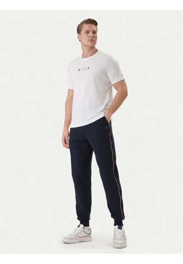 TOMMY HILFIGER - Tommy Hilfiger Spodnie dresowe Global Stripe MW0MW42882 Niebieski Regular Fit. Kolor: niebieski. Materiał: bawełna