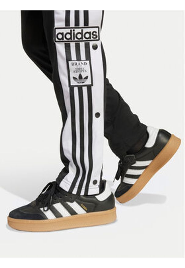 Adidas - adidas Spodnie dresowe Adibreak JX1091 Czarny Regular Fit. Kolor: czarny. Materiał: syntetyk