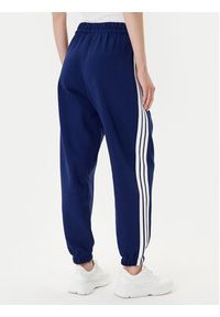 Adidas - adidas Spodnie dresowe Essentials 3-Stripes Fleece JX7696 Niebieski Loose Fit. Kolor: niebieski. Materiał: bawełna, syntetyk #4