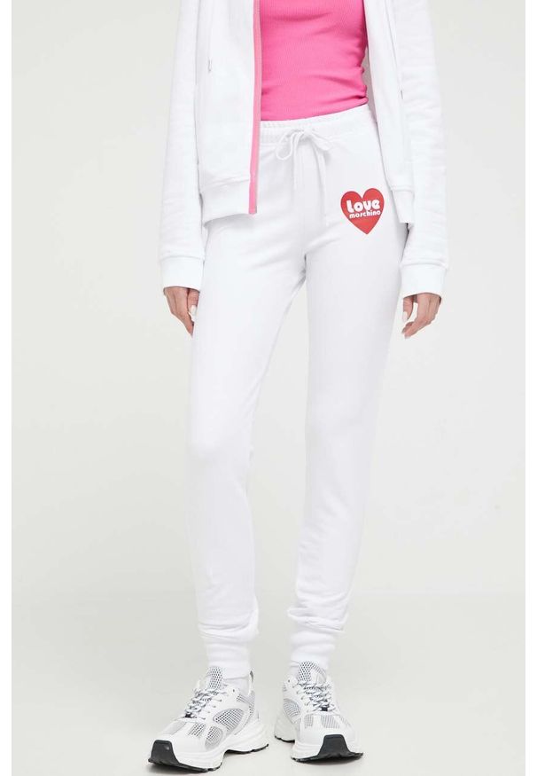 Love Moschino spodnie dresowe kolor biały z nadrukiem. Kolor: biały. Materiał: dresówka. Wzór: nadruk